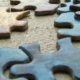 Puzzle pieces scattered on a table_canstockphoto187456 760x320