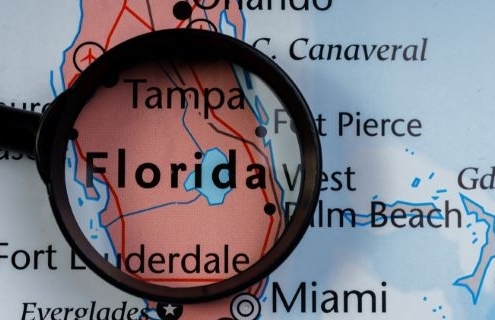 map of florida with magnifying glass_shutterstock_1209024583 760x320