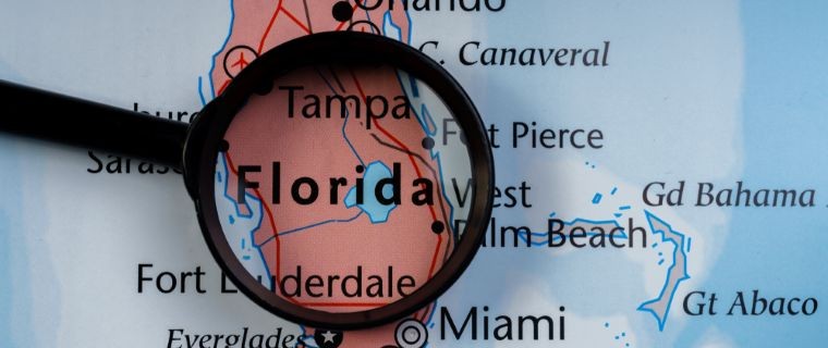 map of florida with magnifying glass_shutterstock_1209024583 760x320